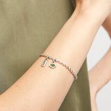 Bracelet with 'suerte' and oval green crystal charm (gold or silver)