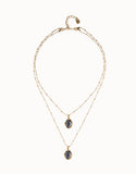 Multi strand necklace with two black oval faceted crystals, gold