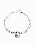 Short beaded necklace with medium and a large sphere, silver