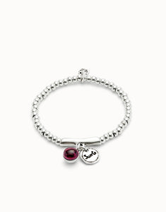 Beaded stretch bracelet with a murano glass and Suerte charm (silver)