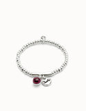 Beaded stretch bracelet with a murano glass and Suerte charm (silver)