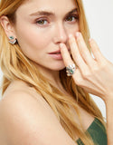 Eye-shaped ring with faceted green crystal
