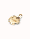 Charm with the word “suerte” (gold)