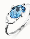 Bangle bracelet with faceted blue crystal, silver